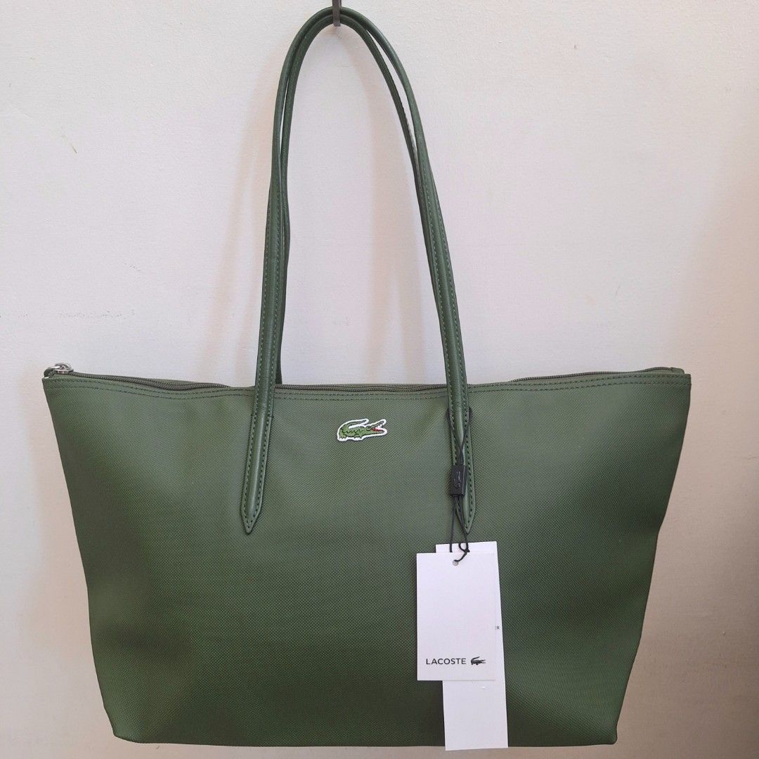 Lacoste Cow Leather Shopping Bag (Category: Luxury Bags & Wallets) located in San Pedro. Submitted by graceleen00 (Listing ID 1309381423, Image 1). Description: Elevate your outfit with the iconic Lacoste Shopping Bag, an image of elegance and sophistication. Features: ○ Small Separate Compartment inside ○ Spacious Interior ○ Zipper Closure ○ 100% Authentic ○ Elegant Design ○ Made of Cow Leather ○ Perfect for Everyday Use ○ Length: 48cm ○ Height: