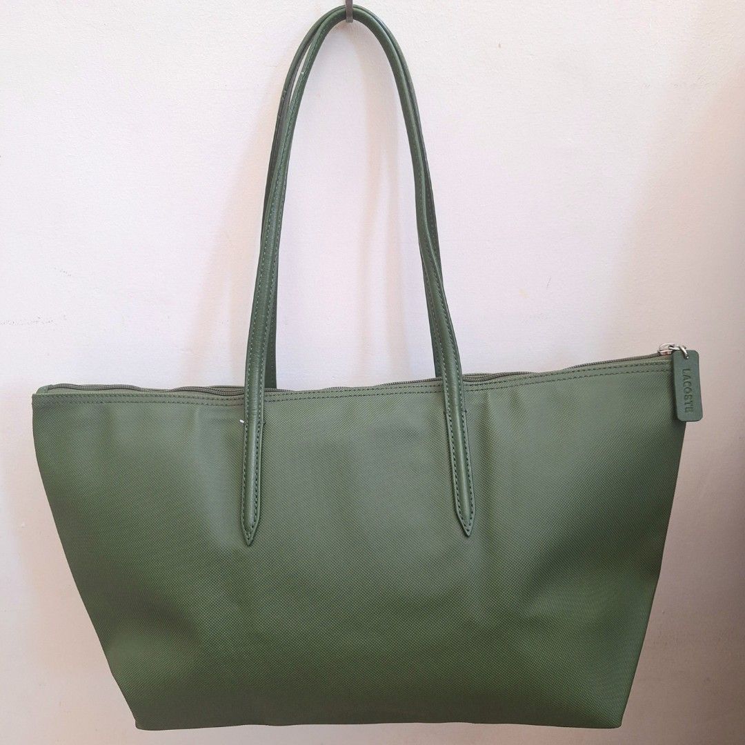 Lacoste Cow Leather Shopping Bag (Category: Luxury Bags & Wallets) located in San Pedro. Submitted by graceleen00 (Listing ID 1309381423, Image 2). Description: Elevate your outfit with the iconic Lacoste Shopping Bag, an image of elegance and sophistication. Features: ○ Small Separate Compartment inside ○ Spacious Interior ○ Zipper Closure ○ 100% Authentic ○ Elegant Design ○ Made of Cow Leather ○ Perfect for Everyday Use ○ Length: 48cm ○ Height: