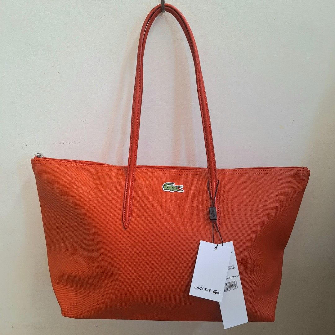 Lacoste Cow Leather Shopping Bag (Category: Luxury Bags & Wallets) located in San Pedro. Submitted by graceleen00 (Listing ID 1309381694, Image 1). Description: Introducing this Red Shopping Bag from Lacoste, crafted with precision and luxury in mind. Elevate your style effortlessly. Features: ○ Small Separate Compartment inside ○ Spacious Interior ○ Zipper Closure ○ 100% Authentic ○ Elegant Design ○ Made of Cow Leather ○ Perfect for Everyday Use
