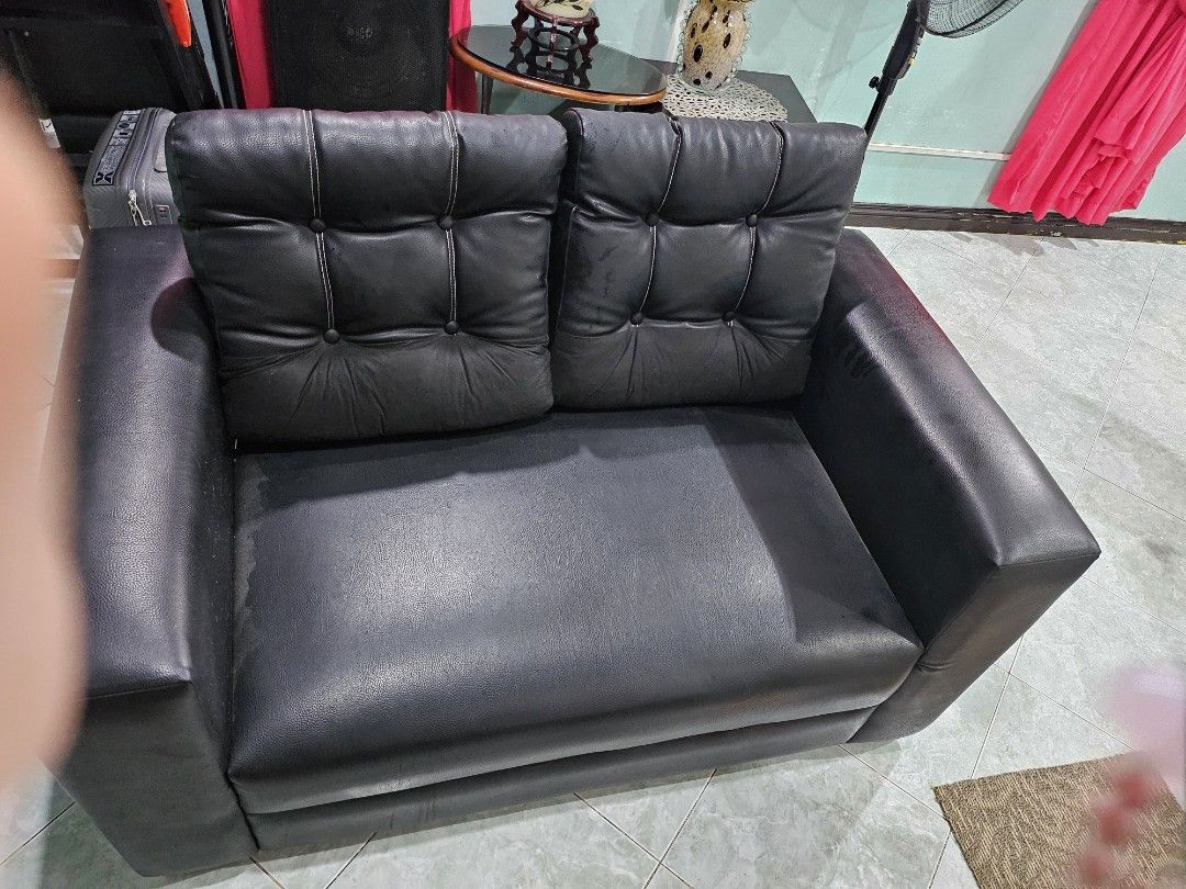 Leather couch sofa (Category: Sofas) located in Pasig City. Submitted by periwinklepeach (Listing ID 1309451857, Image 1). Description: very good condition no flaw with cushion.
