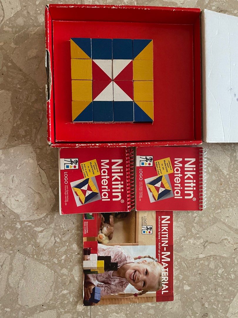 Pattern cubes & puzzle (Category: Board Games & Puzzles) located in Singapore. Submitted by vinydz (Listing ID 1309364617, Image 3). Description: Build-up game. The idea is to put 16 wooden cubes with 6 differently coloured surfaces together. Two booklets (56 & 72 pages) full of attractive designs. Get FREE Magic Geometric Puzzle..