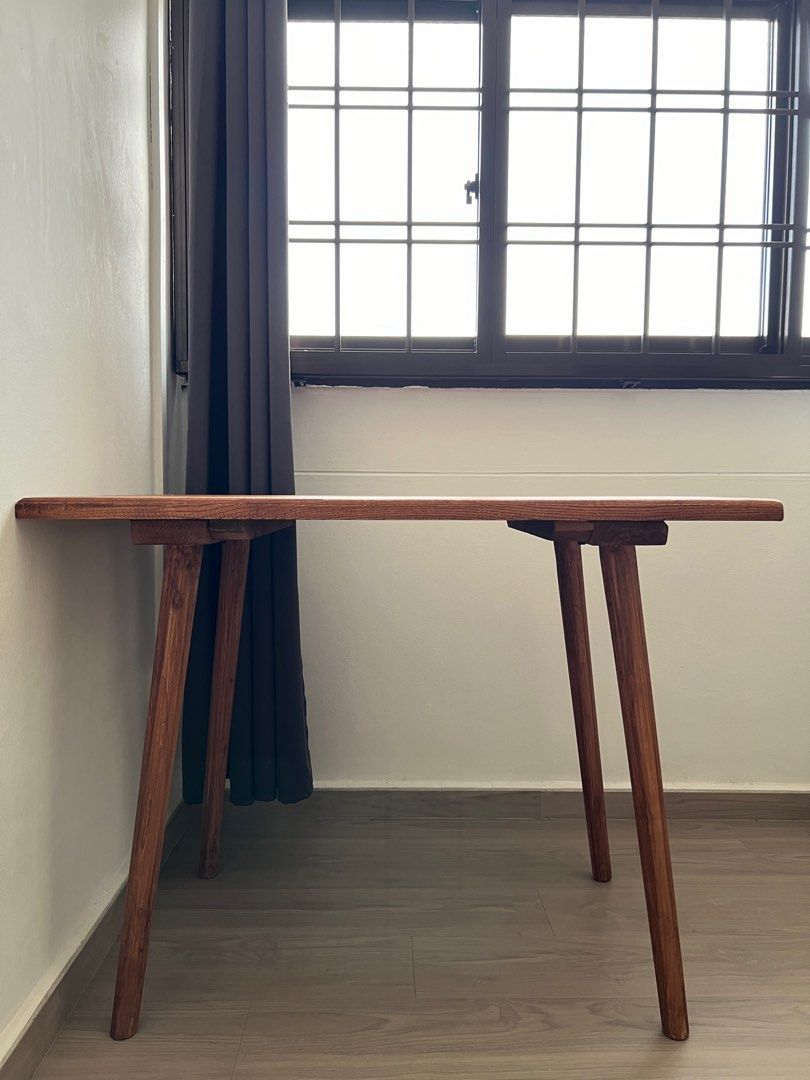 Solid Wood Table (Category: Tables & Sets) located in Singapore. Submitted by anthonyths (Listing ID 1309436286, Image 2). Description: Solid wood table. The holes on the table top is there when i bought it as the table was made with reusable wood. .