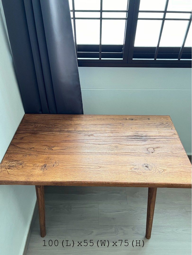 Solid Wood Table (Category: Tables & Sets) located in Singapore. Submitted by anthonyths (Listing ID 1309436286, Image 1). Description: Solid wood table. The holes on the table top is there when i bought it as the table was made with reusable wood. .