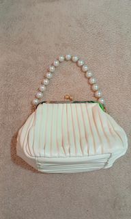White party kisslock bag with pearl bead strap