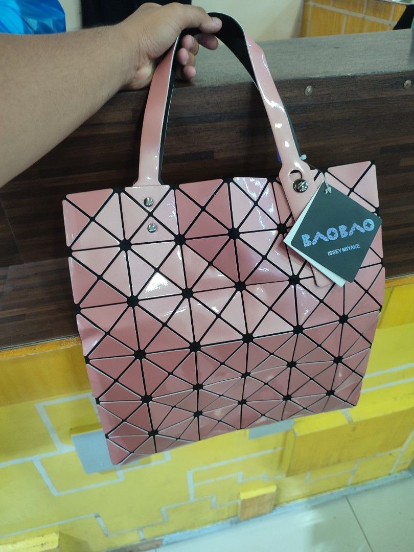 Issey Miyake Hand Bag (Category: Luxury Bags & Wallets) located in Bacolod City. Submitted by money_maker06 (Listing ID 1309661628, Image 1). Description: Issey Miyake Hand Bag 🌳 •Comes with “Issey Miyake BaoBao Signature Design” 🪵 •With HangTags 🖍️ •Complete Details 🌴 •For Men/Women ✅ •2 Compartments 🔖 •It can fit 3-10 items depends on the size of the item 🖊 •Condition: Good📍 •Issue:vJust a normal sign of used ✔️ •Needs cleaning 🧼 •Price