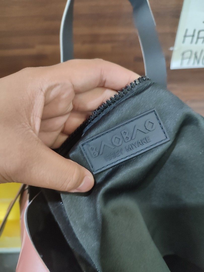 Issey Miyake Hand Bag (Category: Luxury Bags & Wallets) located in Bacolod City. Submitted by money_maker06 (Listing ID 1309661628, Image 3). Description: Issey Miyake Hand Bag 🌳 •Comes with “Issey Miyake BaoBao Signature Design” 🪵 •With HangTags 🖍️ •Complete Details 🌴 •For Men/Women ✅ •2 Compartments 🔖 •It can fit 3-10 items depends on the size of the item 🖊 •Condition: Good📍 •Issue:vJust a normal sign of used ✔️ •Needs cleaning 🧼 •Price