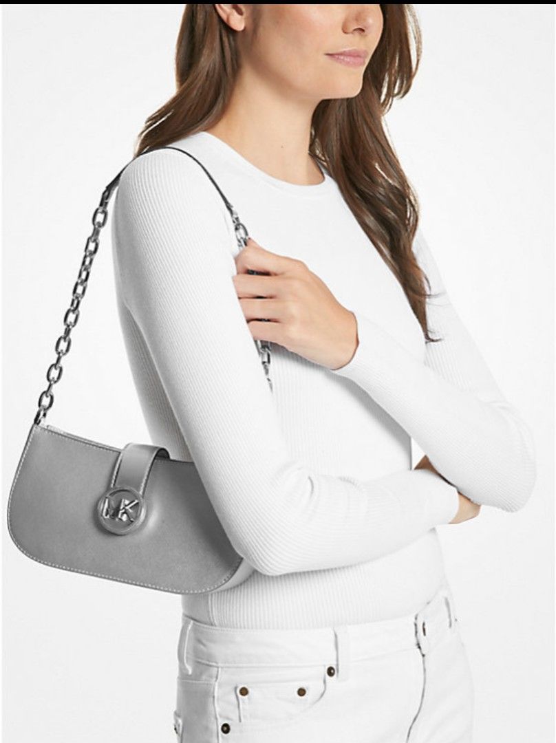 Michael Kors Carmen Small Metallic Shoulder Bag (Category: Luxury Bags & Wallets) located in Caloocan City. Submitted by yfb_31 (Listing ID 1309632156, Image 1). Description: brandnew original Michael Kors Carmen Small Metallic Shoulder Bag Shoulder bag • Metallic • 88.92% coated canvas/11.08% polyester • Trim: 100% polyurethane • Silver-tone hardware • 9.5”W X 5”H X 3”D • Handle drop: 14” • Interior details: 3 card slots • Lining: 100% polyester