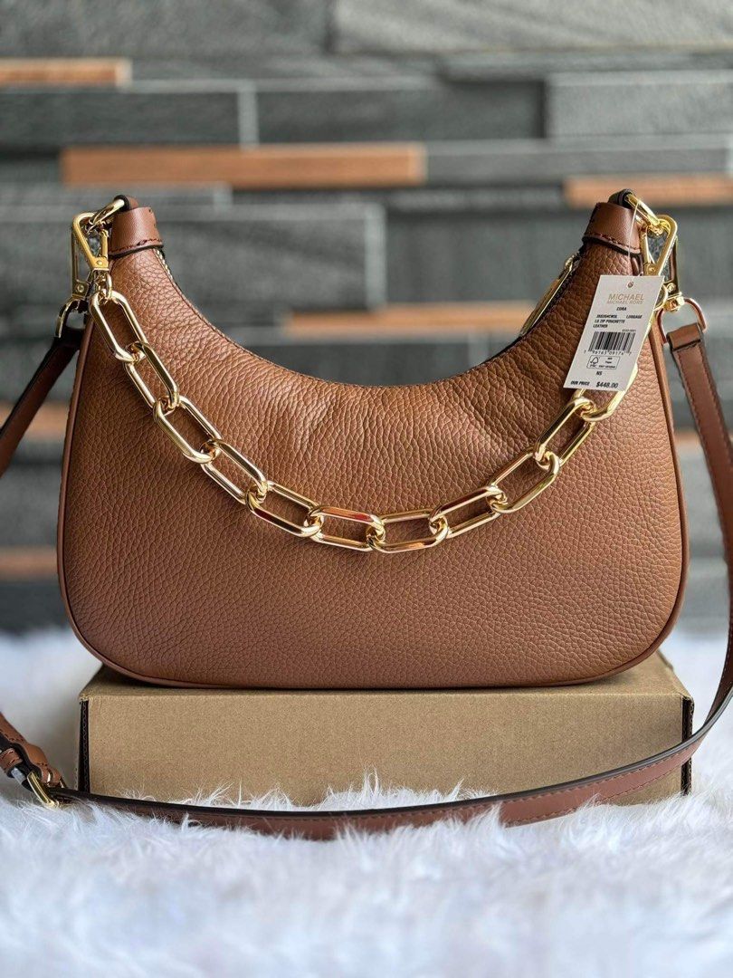 MK LARGE CORA (Category: Cross-body Bags) located in Mandaluyong City. Submitted by stuffnmore (Listing ID 1309617640, Image 1). Description: Mk LARGE Cora Pinas onhand Comes with 2 detachable strap Inclusion tag and chargecard Guaranteed original and new Product details Shoulder bag / crossbody • pebbled leather • Gold-tone hardware • 11.25”W X 8.75”H X 2.5”D • Handle drop: 10.5” • Adjustable strap: 18.75 – 22.25” • Interior details: back and fr