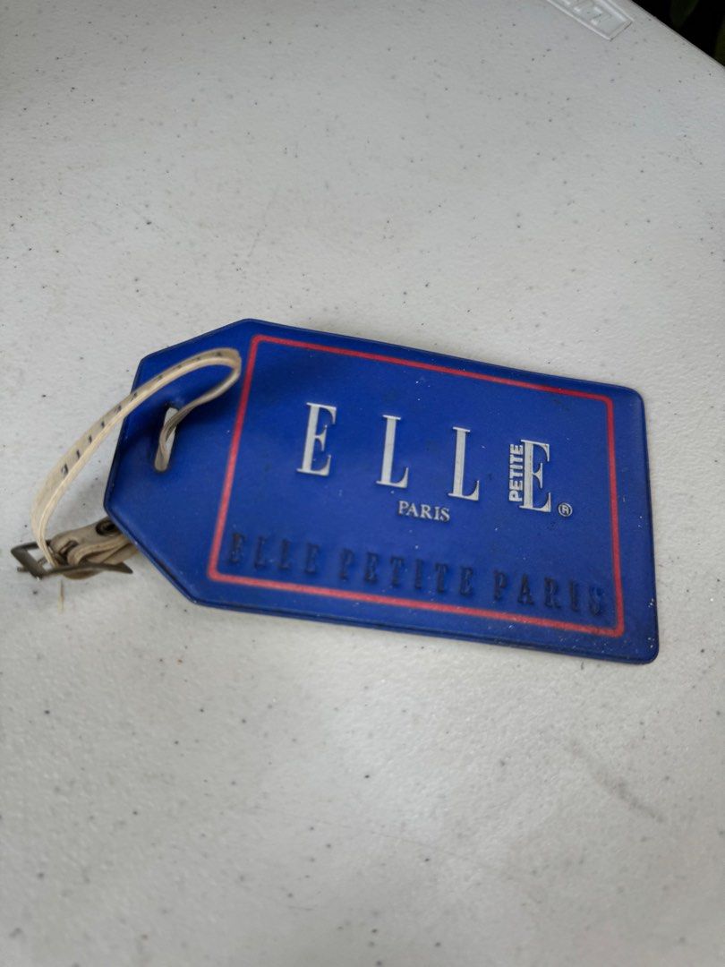 One piece Elle luggage tag (Category: Luggage) located in Davao. Submitted by parteawares2 (Listing ID 1309653482, Image 1). Description: One piece Elle luggage tag.
