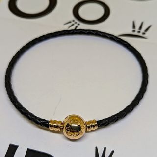 Pandora wooven black leather bracelet with gold claps in