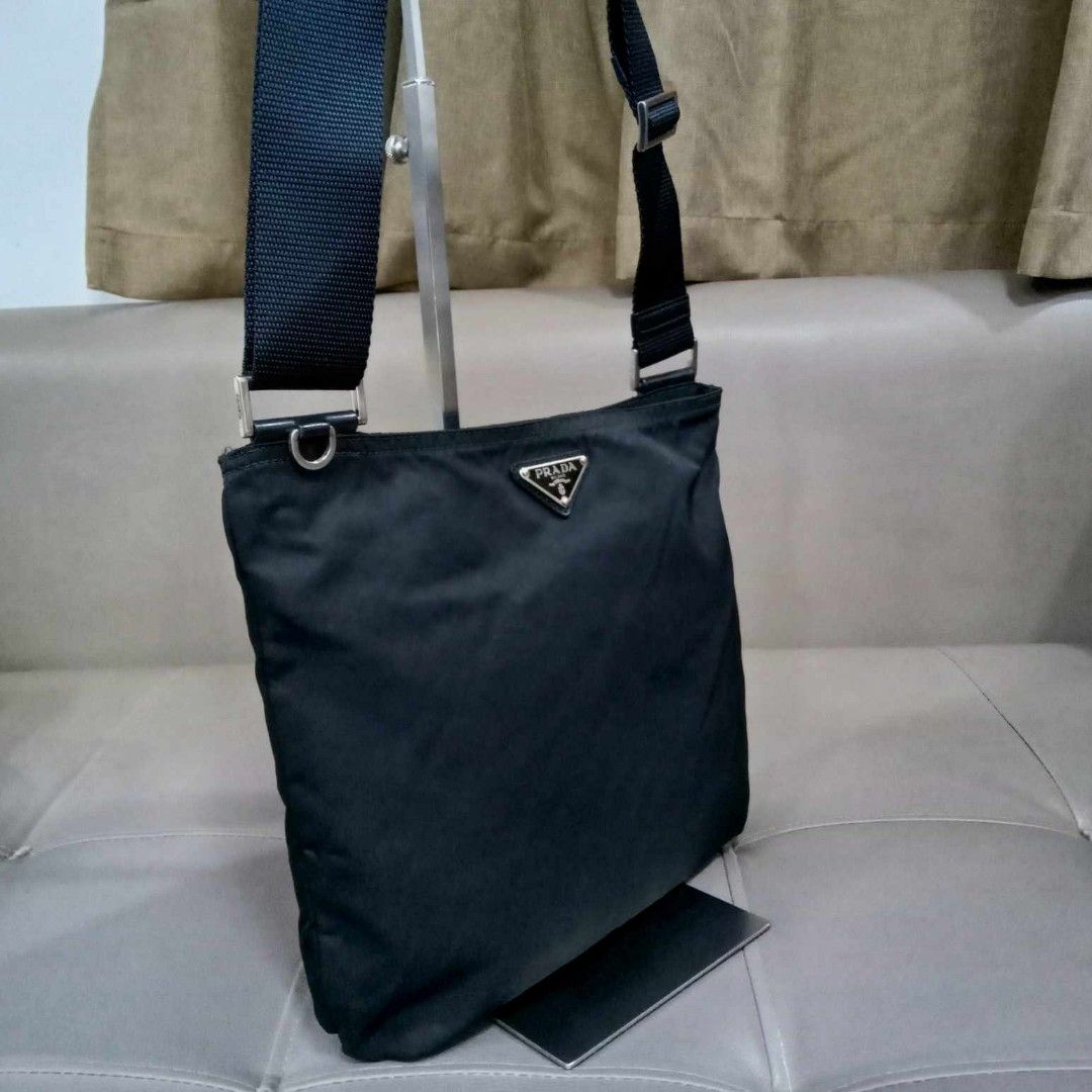 Prada Black Nylon Sling Bag (Category: Luxury Bags & Wallets) located in Taguig. Submitted by esa.agustin (Listing ID 1309586868, Image 2). Description: Original Prada black nylon sling bag. Made in Italy..