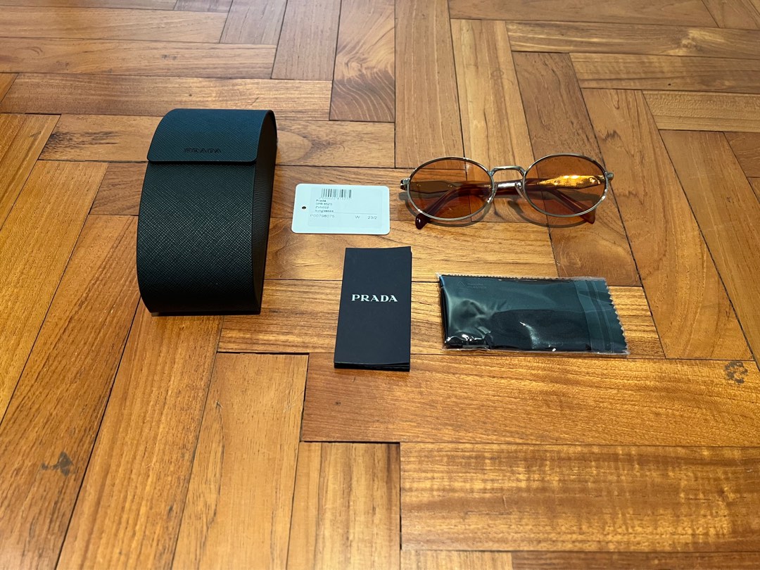 Prada sunglasses round frame discount