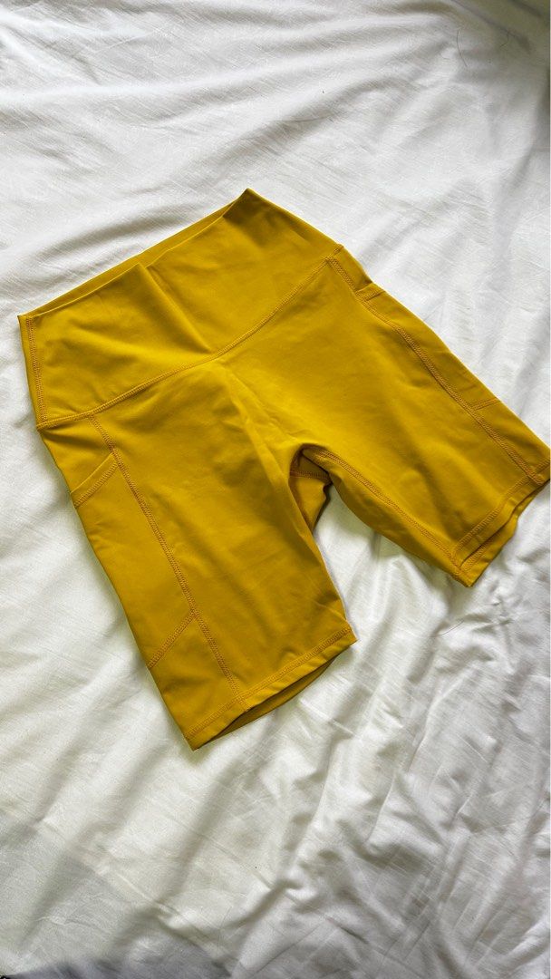 Yellow tights 8 shorts with pockets Women s Fashion Activewear on Carousell
