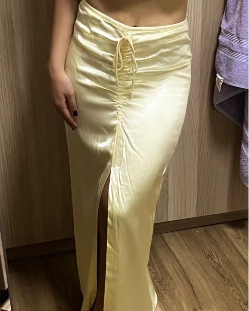 ZARA Yellow Satin Skirt (Category: Skirts) located in Pasig City. Submitted by kvdecluttering (Listing ID 1309567439, Image 3). Description: ZARA SATIN SKIRT YELLOW With front slit Has side zipper Size XS (fits W24-25) Length 33in Used 1x Sf P80 within metro mnl.
