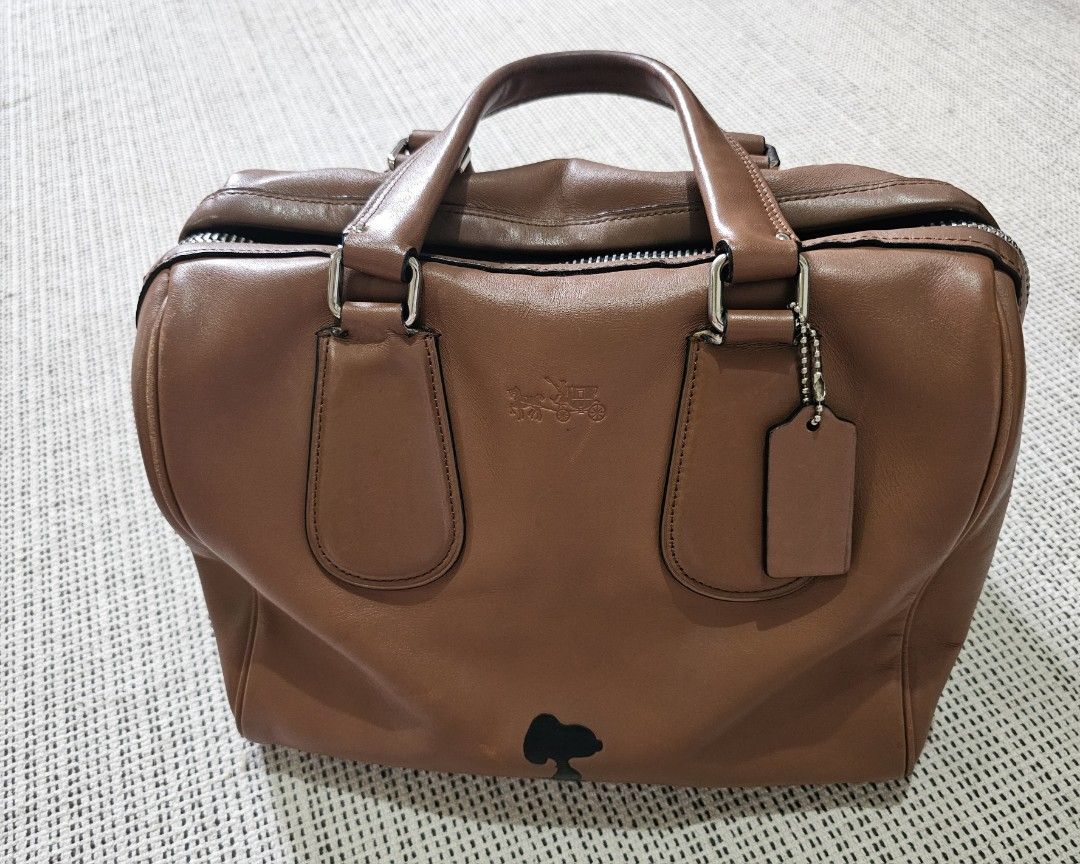 Coach Speedy Bag (Snoopy) Limited Edition (Category: Luxury Bags & Wallets) located in Bulacan. Submitted by kcatsan (Listing ID 1306560362, Image 1). Description: Authentic, Well used leather, with light discoloration due to usage and storage, with peelings on the handle Big, roomy but lightweight.