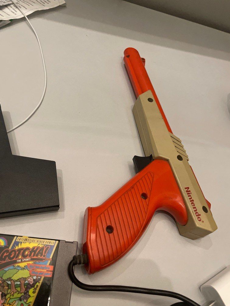 Gotcha Game and Vintage light Gun set (Category: Nintendo) located in Makati City. Submitted by alex_sevilla (Listing ID 1306660704, Image 3). Description: Light Gun Gotcha game NES Instruction manual Makati area only Both working .