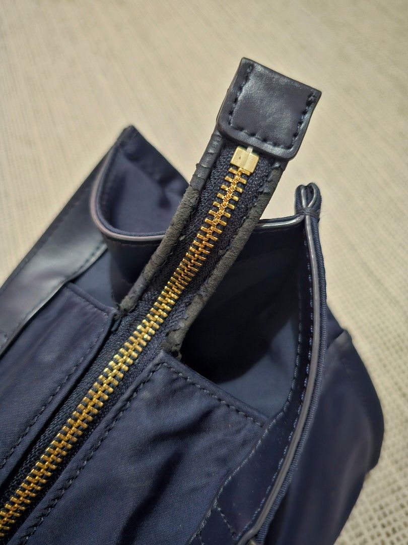 Kate Spade Nylon SAM Tote Bag (Category: Luxury Bags & Wallets) located in Bulacan. Submitted by kcatsan (Listing ID 1306556007, Image 3). Description: Used, Authentic well used, has peeling on the handles and zipper but can be changed/replaced in Mr Quickie no discolorations.