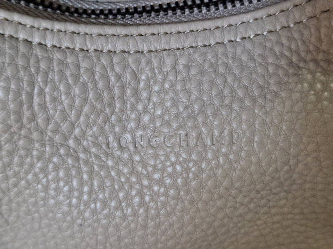 Longchamp small hobo (Category: Luxury Bags & Wallets) located in Quezon City. Submitted by myprelovedfindsph (Listing ID 1306553321, Image 2). Description: Brand new Longchamp hobo bag. Priced at 27k in Rustans. Great everyday casual bag..