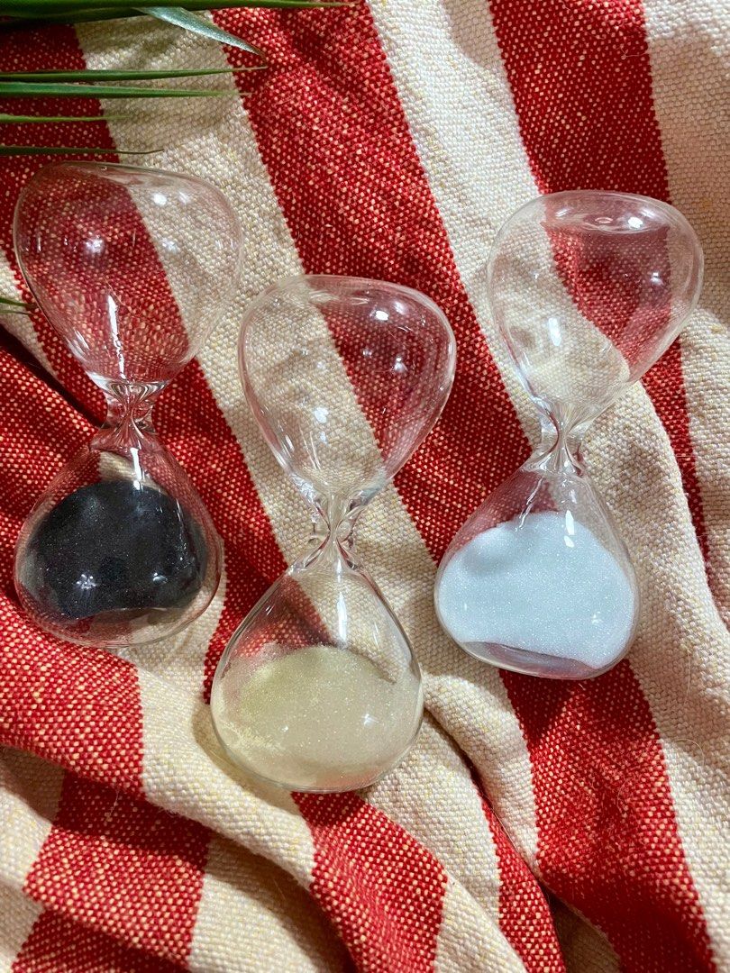 Set of 3 hourglasses (Category: Other Home Decor) located in Paranaque City. Submitted by cngaya (Listing ID 1306612013, Image 2). Description: 1000 for all 3. The beige hourglass has a minor issue where sand sticks to the side when you turn the hour glass over. But when you leave it for a few minutes and gently tap the glass, the sand goes down. Does not affect aesthetics, I always just used them for display. Please see photos. In good condition