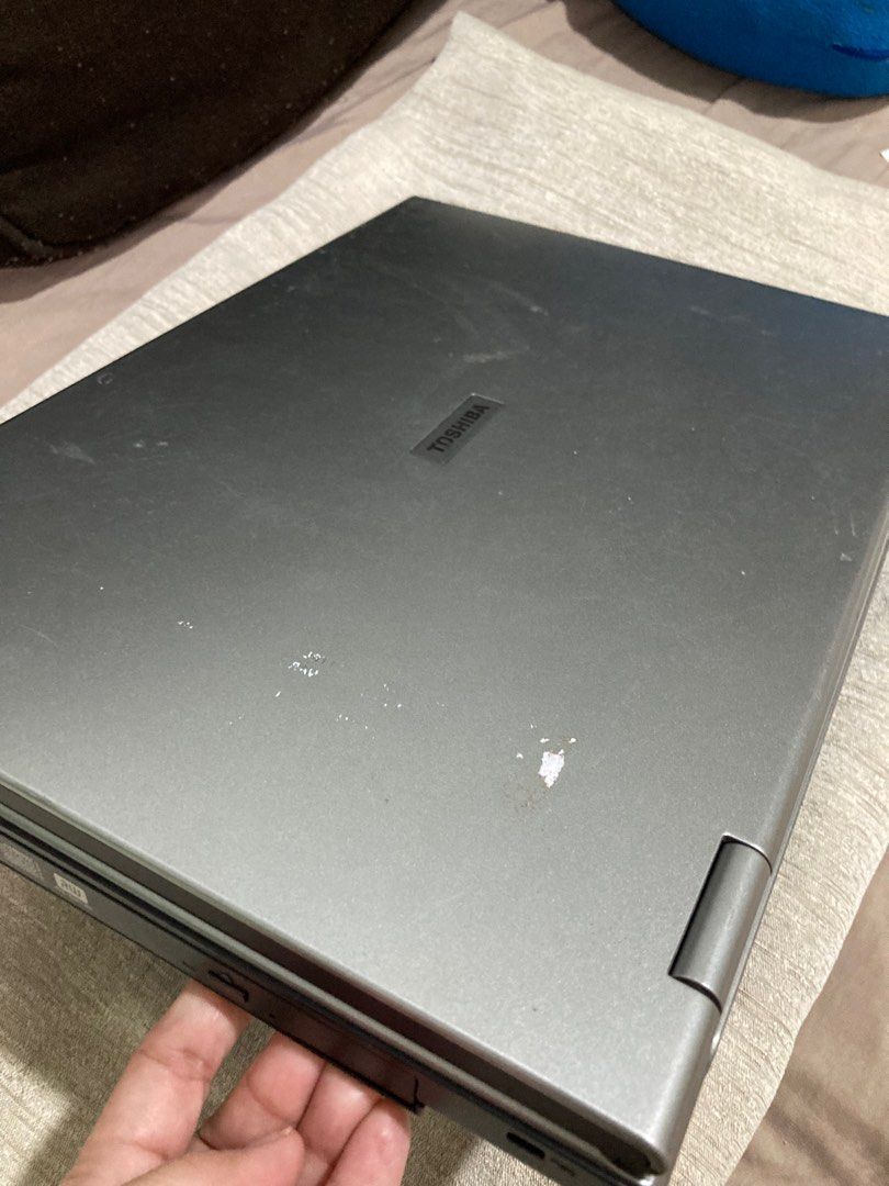 Toshiba Tecra laptop (Category: Laptops & Notebooks) located in Cagayan de Oro. Submitted by kaeo44 (Listing ID 1306584947, Image 2). Description: Selling for parts. Toshiba Tecra vintage selling for parts. Damaged in balikbayan box and storage here in Philippines. Cracked LCD and scratches present in top cover.