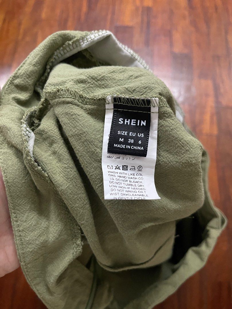 Wrap Skirt (Category: Skirts) located in Paranaque City. Submitted by stphraynes (Listing ID 1306541021, Image 3). Description: Shein Knot Side Wrap Skirt - Used once - Size: Medium (fits up to semi large) -Color: Green.