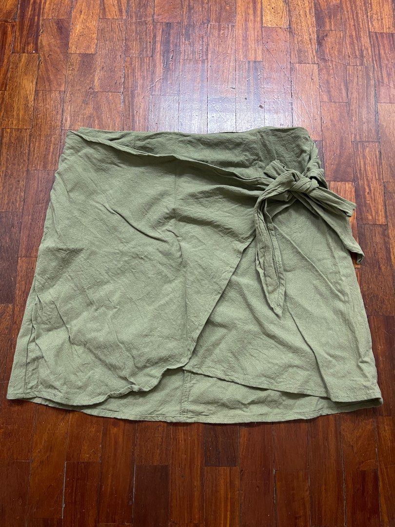 Wrap Skirt (Category: Skirts) located in Paranaque City. Submitted by stphraynes (Listing ID 1306541021, Image 1). Description: Shein Knot Side Wrap Skirt - Used once - Size: Medium (fits up to semi large) -Color: Green.