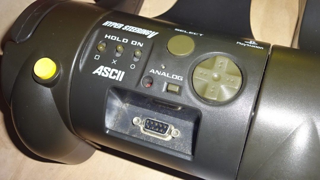 ASCII Hyper Steering V Steering Wheel PS1 (Category: Controllers) located in Paranaque City. Submitted by kutoi.ancheta (Listing ID 1309868114, Image 3). Description: ASCII Hyper Steering V Steering Wheel PS1 ₱2500 condition: untested! Compatibility is buyer's responsibility! as is only! no warranties! For display props or collection purposes! pm for inquiries. #asciicontroller #asciisteeringwheel #racingcontroller.