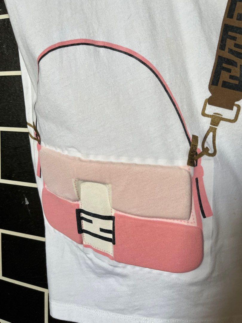 Authentic Fendi Shirt (Category: Shirts) located in Paranaque City. Submitted by flees.thrift10 (Listing ID 1309793551, Image 3). Description: Ganda neto Kids on tag Kasya sa small to medium semi strechable Minimal flaw lng yung parang yellow pero washable ibabad lng not visble.