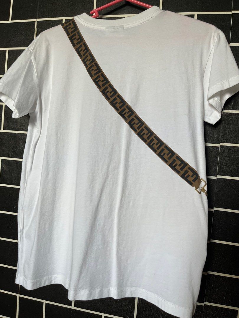 Authentic Fendi Shirt (Category: Shirts) located in Paranaque City. Submitted by flees.thrift10 (Listing ID 1309793551, Image 2). Description: Ganda neto Kids on tag Kasya sa small to medium semi strechable Minimal flaw lng yung parang yellow pero washable ibabad lng not visble.