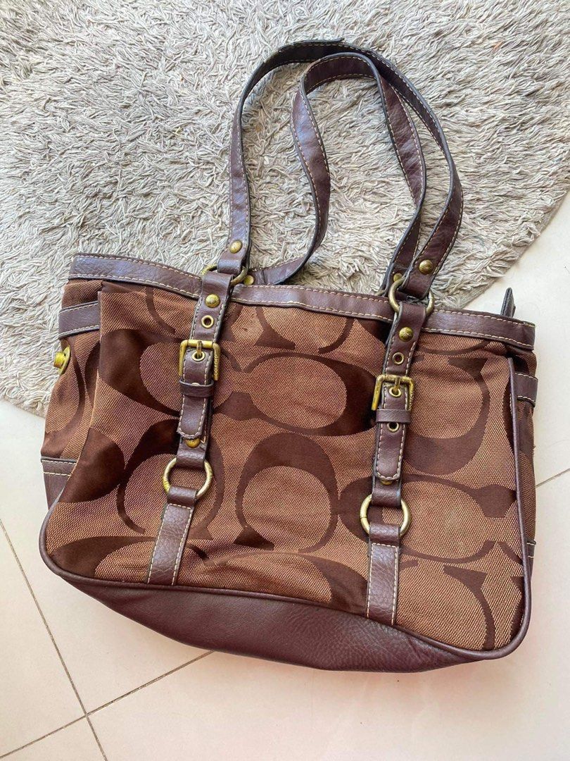 BUNDLE Coach Monogram Brown Buckle Shoulder Bag (Category: Luxury Bags & Wallets) located in Mandaue City. Submitted by y2kmallows.ph (Listing ID 1309774805, Image 2). Description: - bought here in carousell as well for 1k+ - very sturdy and spacious - width - 14in - with authenticity card/ tag inside FREE WHITE BAG (seller didnt indicate flaws so Ill be honest flaws are stated below) - flaws shown in photos • Repainted hardware • Run at back • R