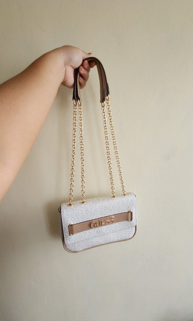 Cresswell Logo Convertible Crossbody (Category: Cross-body Bags) located in Quezon City. Submitted by allstopshop (Listing ID 1309777046, Image 2). Description: Cresswell Logo Convertible Crossbody - Bought in Canada - With Item tag - Brand new, never been used but has a super light blue mark at the back (didnt notice when bought) More details are found here https://www.guessfactory.com/ca/en/handbags/all-handbags/crossbody/creswell-logo-converti