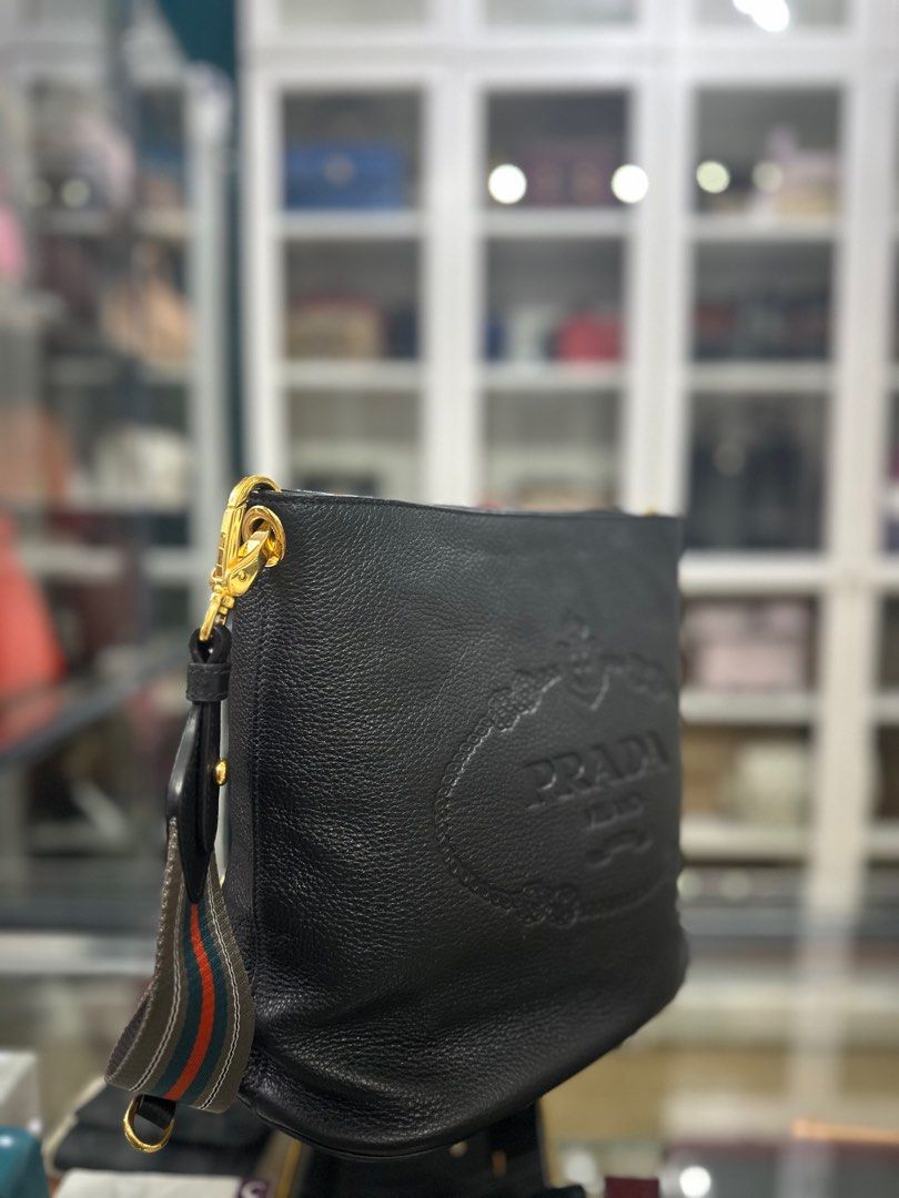 Prada 1BE057 Secchiello in Black Vitello Phenix Bag (Category: Luxury Bags & Wallets) located in Taguig. Submitted by closetcompany (Listing ID 1309768962, Image 2). Description: Prada 1BE057 Secchiello in Black Vitello Phenix Bag 🫧Php 70,000 🫧CONDITION: Unused with minor hairline scratches on the hardwares from storage 🫧RATING: 9.8/10 🫧INCLUSIONS: dust bag, detachable & adjustable strap, information cards, and Entrupy certificate 🫧Modes of 