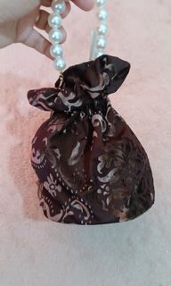 Brown brand new formal drawstring bag with pearl strap