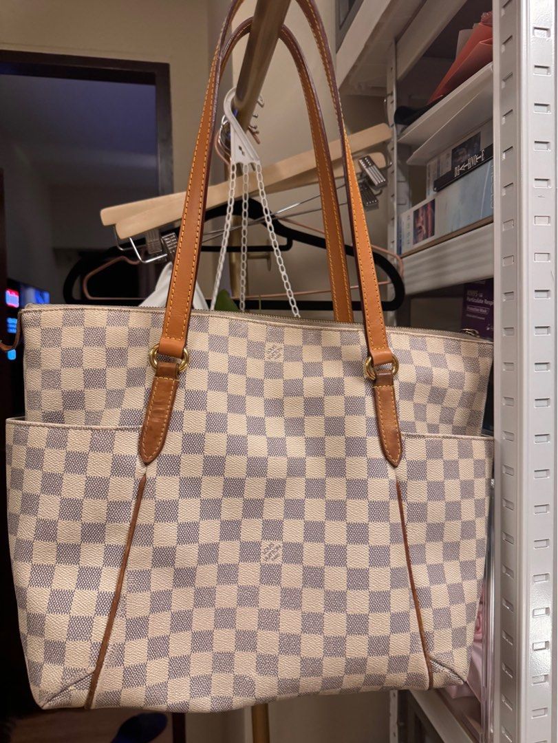 Louis Vuitton Damier Azur Totally GM (Category: Luxury Bags & Wallets) located in Pasig City. Submitted by prelovedbyladyrosita (Listing ID 1310029017, Image 2). Description: 📌 faint stain 📌 canvas smell 📌 dirt in zipper and inside stains, but with free bag organizer 📌 replaced handles, though you can keep the original LV straps 📍 Ships from Pasig City through Grab or Lalamove 📱 Payment via GCash.
