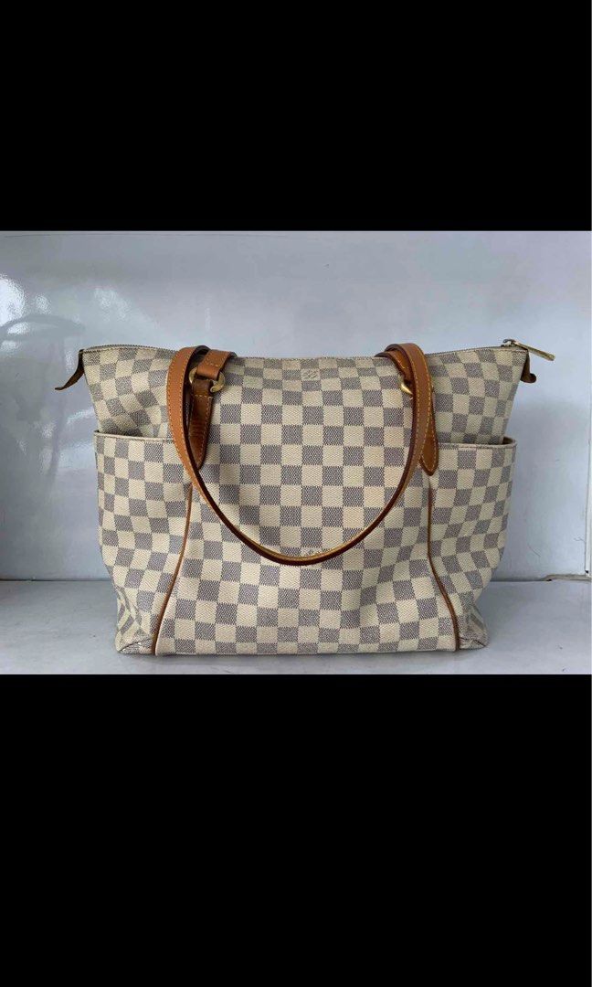 Louis Vuitton Damier Azur Totally GM (Category: Luxury Bags & Wallets) located in Pasig City. Submitted by prelovedbyladyrosita (Listing ID 1310029017, Image 1). Description: 📌 faint stain 📌 canvas smell 📌 dirt in zipper and inside stains, but with free bag organizer 📌 replaced handles, though you can keep the original LV straps 📍 Ships from Pasig City through Grab or Lalamove 📱 Payment via GCash.