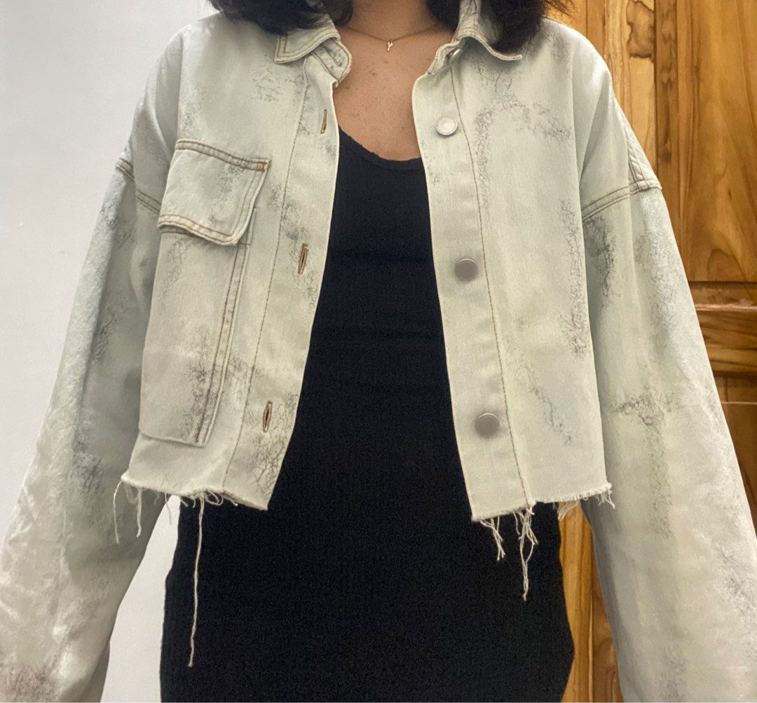 Tattered denim jacket (Category: Coats, Jackets and Outerwear) located in Caloocan City. Submitted by aneeeee_ (Listing ID 1309820618, Image 3). Description: Size M on tag but can fit up to L-XL Light denim color Design po yung parang black niya sa jacket Super nice sa actual Disclaimer: actual color may vary due to the lighting. 🥹 .
