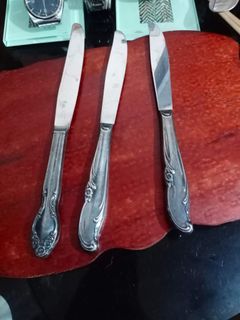 Three (3) pieces silver-plated "dinner knife".
