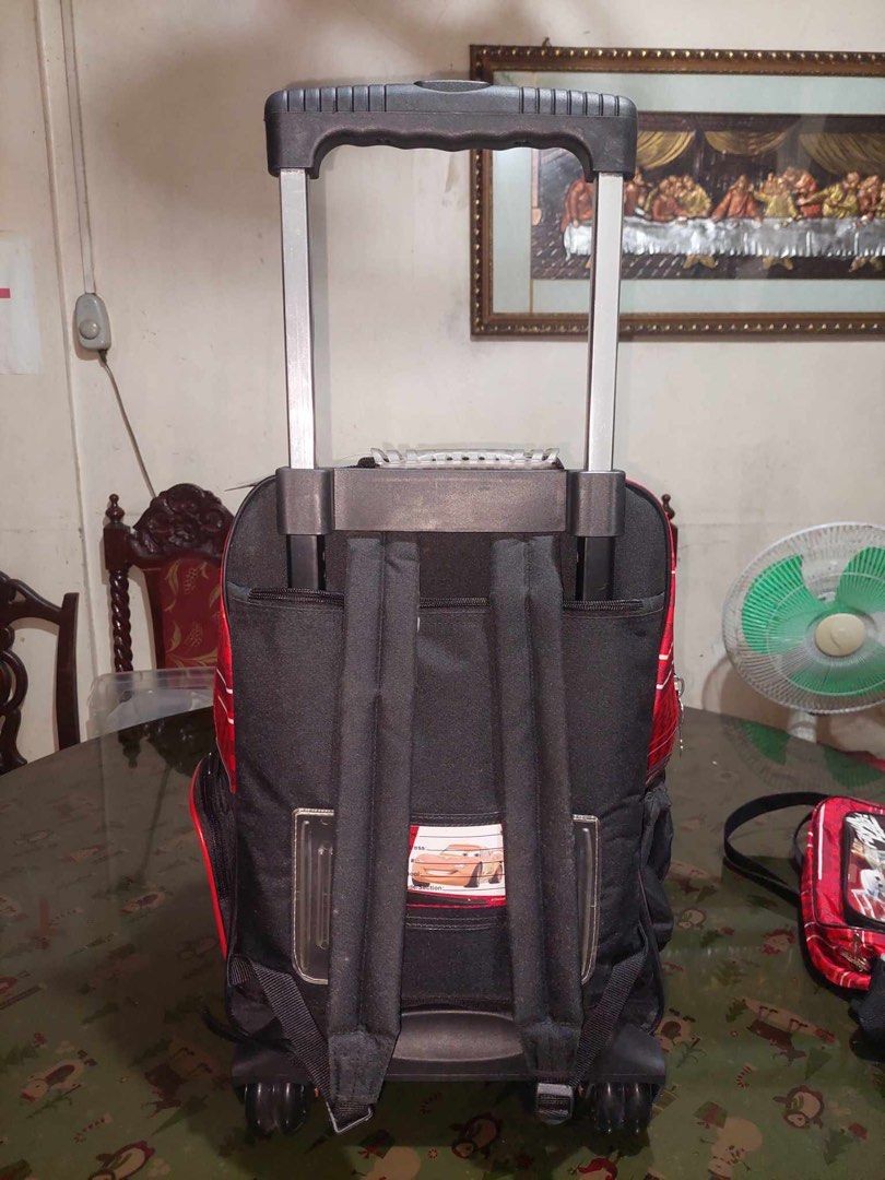 Trolly Bag (Category: Everything Else Others) located in Manila. Submitted by jennygonzalez2011 (Listing ID 1310064182, Image 3). Description: Backpack/Trolley , - Wide Open Compartment , - Four Spinner Wheels , - Water Jug Holder , - Front Zip Up Pocket , - Right Side Zip Up Pocket.