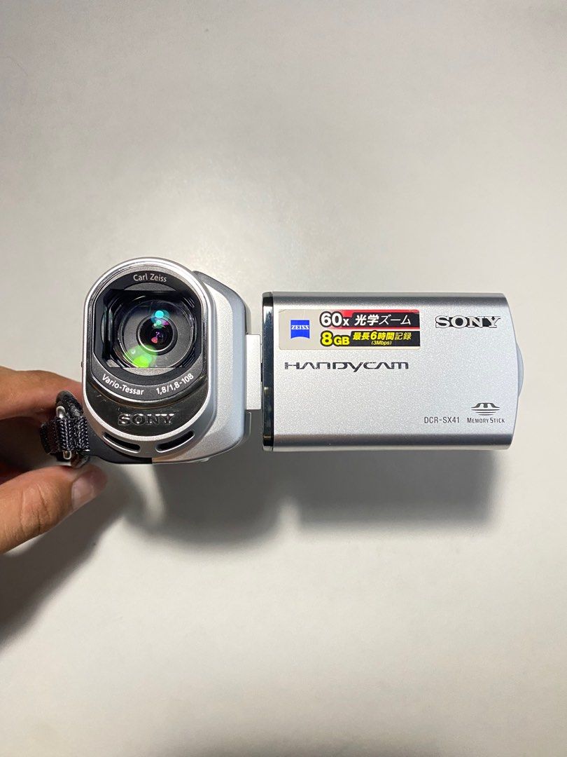 Digital Handy Camera Sony DCR-SX41 (Category: Video Cameras) located in Valenzuela. Submitted by alfeopaulramos7490 (Listing ID 1310231420, Image 2). Description: Digital HandyCam Sony DCR-SX41 60X Optical Zoom (silver) P6,499 ONLY INCLUSION: * sony dcr-sx41 body * brand new original sony battery np-fh70 * original sony battery np-fh30 (extra batt) * brand new original sony adapter * brand new original sony cable * brand new original sony charger
