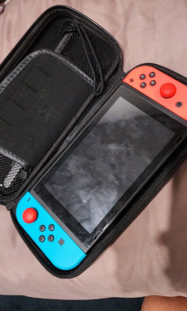 Nintendo Switch V2 (Category: Nintendo) located in Makati City. Submitted by sneakerkid (Listing ID 1309925634, Image 2). Description: Complete Package -screen protector intalled -free travel case -free thumb grip cover Issue -Cosmetic wear on Thumb grips.