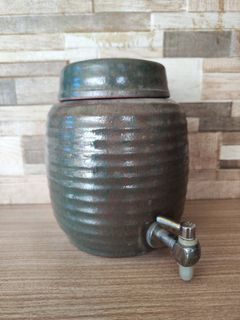Pot with faucet