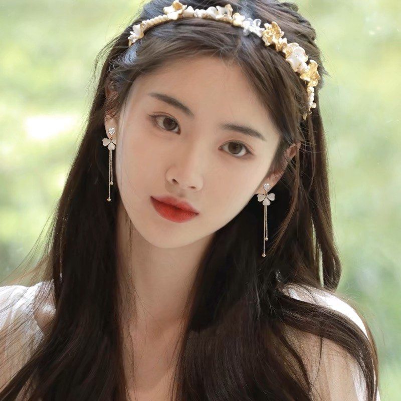The girl wearing tassel earring clearance