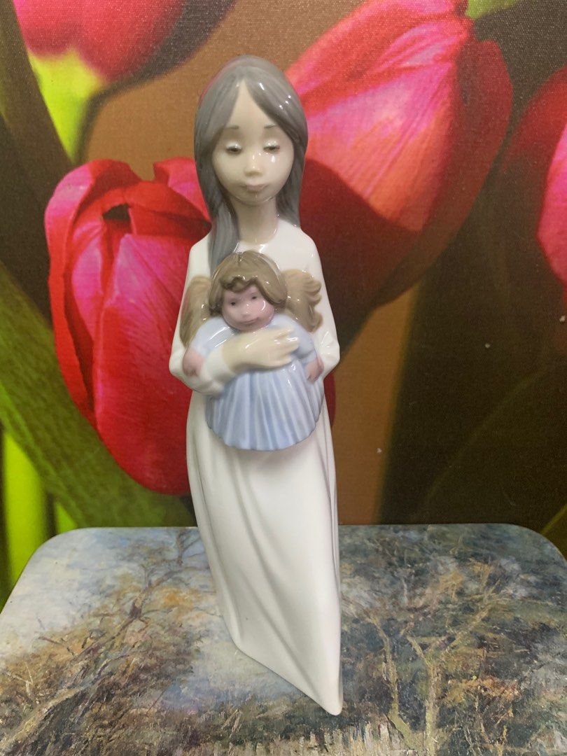 Nao girl with doll sales