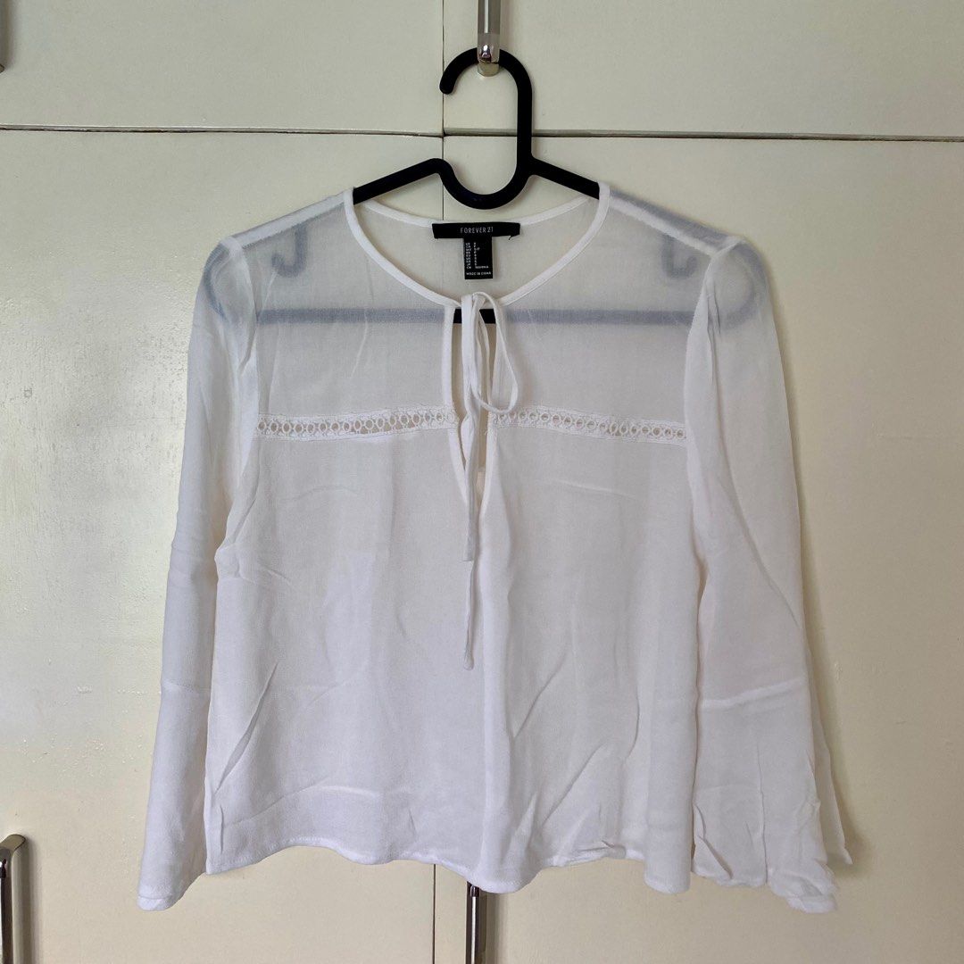 Forever 21 White Top (inner not included) (Category: Blouses) located in Roxas City. Submitted by jade.ring (Listing ID 1310281635, Image 3). Description: - mod: j&t from roxas city, capiz, visayas - fits s/m - bell sleeves - front part (with the strings) is adjustable - inner not included - FIXED PRICE.