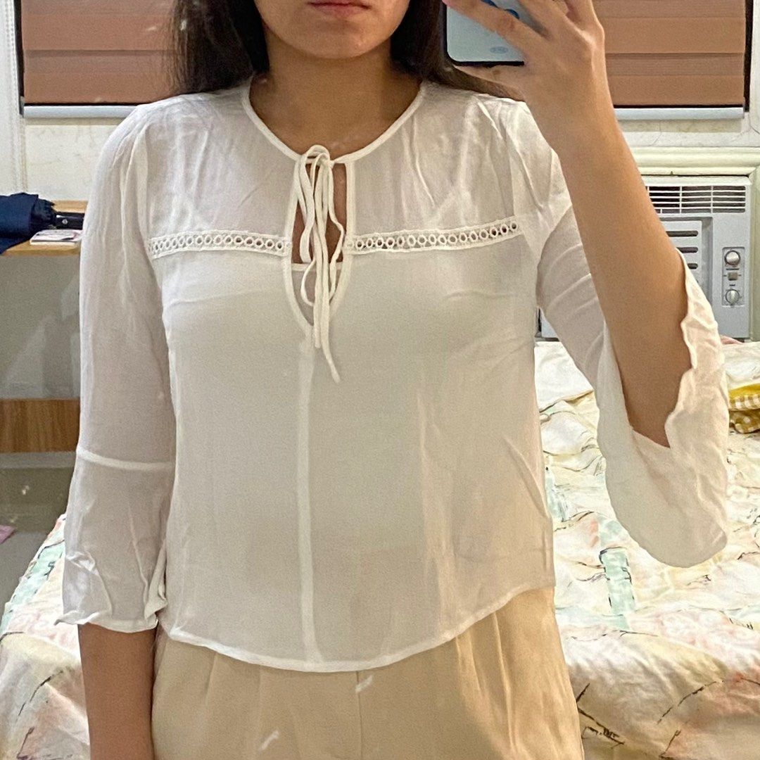 Forever 21 White Top (inner not included) (Category: Blouses) located in Roxas City. Submitted by jade.ring (Listing ID 1310281635, Image 1). Description: - mod: j&t from roxas city, capiz, visayas - fits s/m - bell sleeves - front part (with the strings) is adjustable - inner not included - FIXED PRICE.