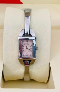 Gucci 6800L Bangle Watch for Women
Square Face
Sapphire Glass 
Pink Mother of Pearl Dial
Swiss Made 
Stainless Steel 
Quartz Movement 
Small to Medium Wrist Size 
With Provided Box Only 
In Excellent Condition