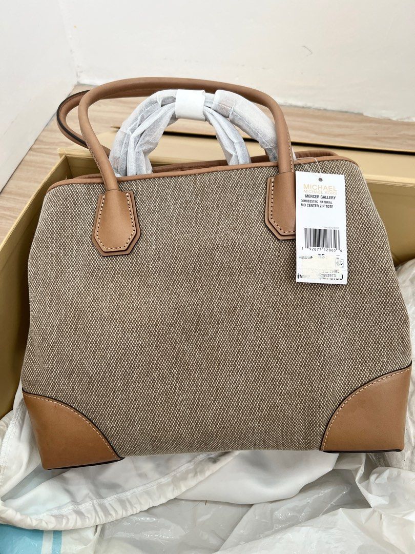 Michael Kors Canvas Center Zip Tote (Category: Luxury Bags & Wallets) located in Bulacan. Submitted by Padmeph (Listing ID 1310260134, Image 3). Description: Bnew with tags Naka stock lang.