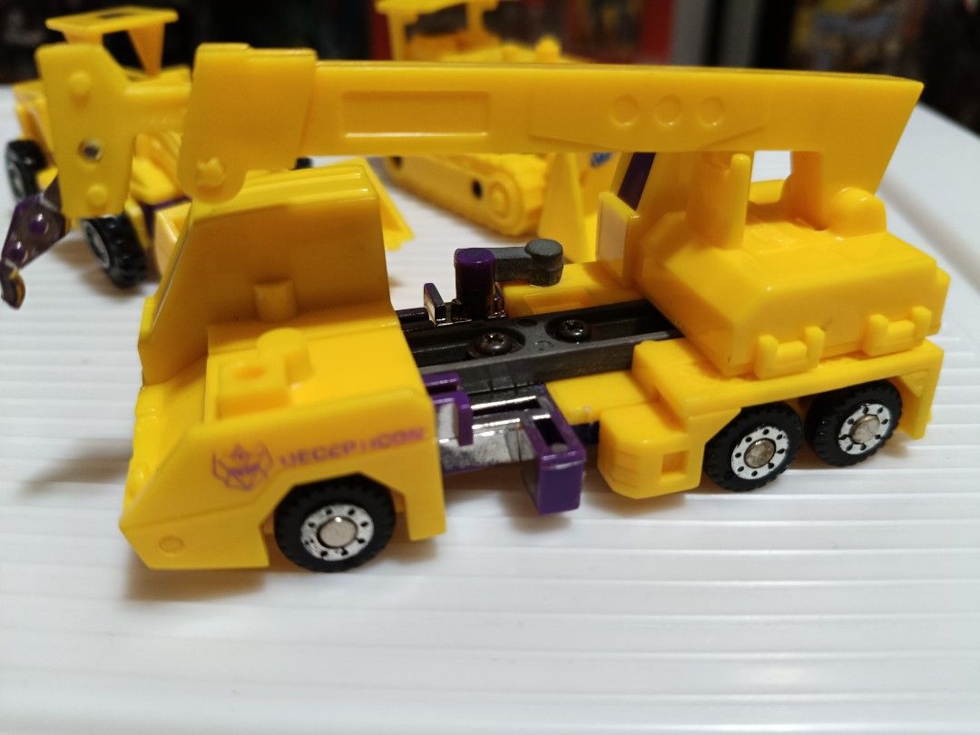 Transformers g2 devastator (Category: Toy Figures) located in Singapore. Submitted by p_don (Listing ID 1310284699, Image 3). Description: Selling loose g2 yellow devastator. Hook had some broken piece. Rest are ok condition. Not for fussy buyer. Buyer please look at my transaction profile before dealing..