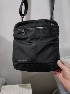 Travelon authentic unisex anti theft sling body  bag lightly used