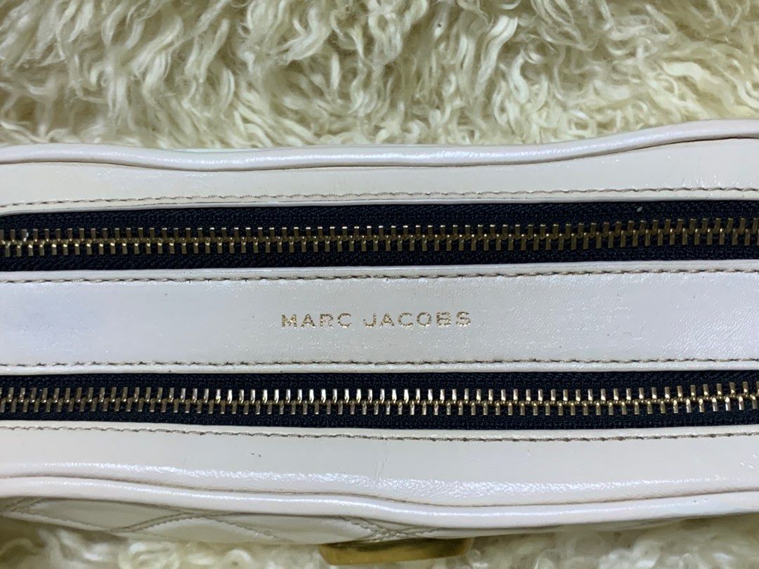 Authentic Marc Jacobs Quilted Soft Shot 21 (Category: Luxury Bags & Wallets) located in Rosario. Submitted by myvinatgepieces (Listing ID 1310549563, Image 3). Description: Authentic Marc Jacobs Soft shot 21 Ivory Color An oversized double-J logo gleams from a supple, quilted leather bag you can carry as a clutch or sling over your shoulder with the optional strap. Quilted Lambskin Leather Replaced Original MJ Guitar Strap Minimal Color Transfer 